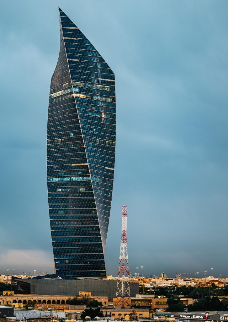 Stunning view of Al Hamra Tower against a dramatic sky in Kuwait City.
